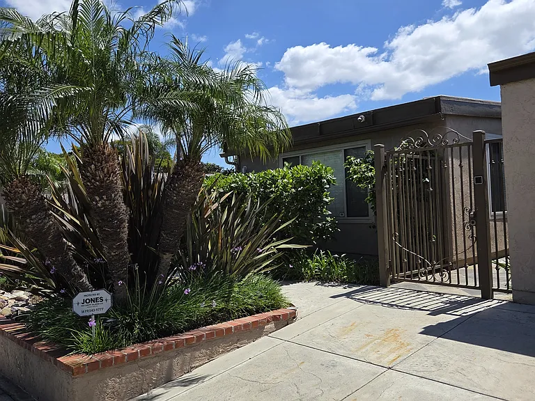 Landscaping in front of house, maintained by landscaper.