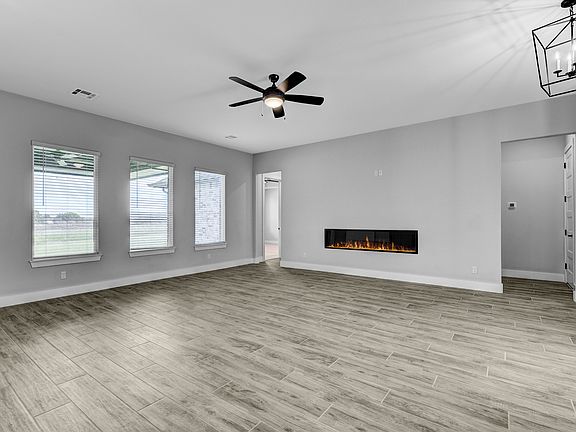 Spacious living room is the perfect setting for gathering with friends and family.