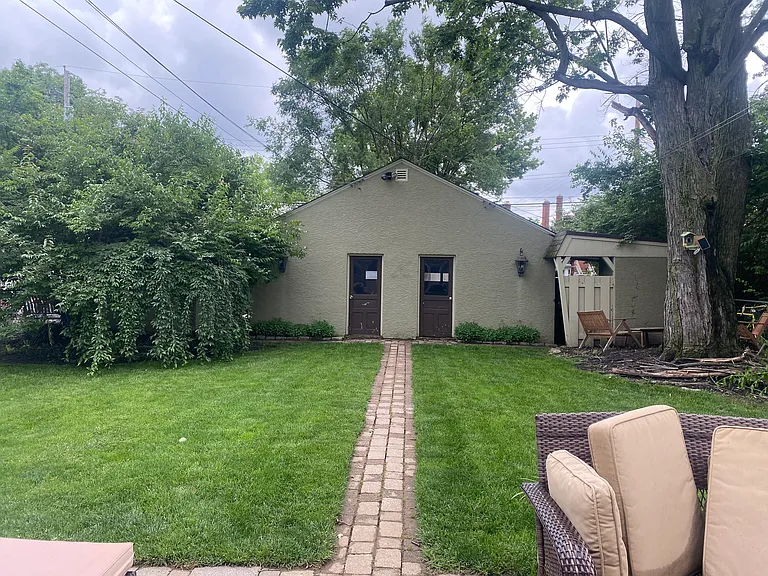 View of the back yard and garage from the mud room.