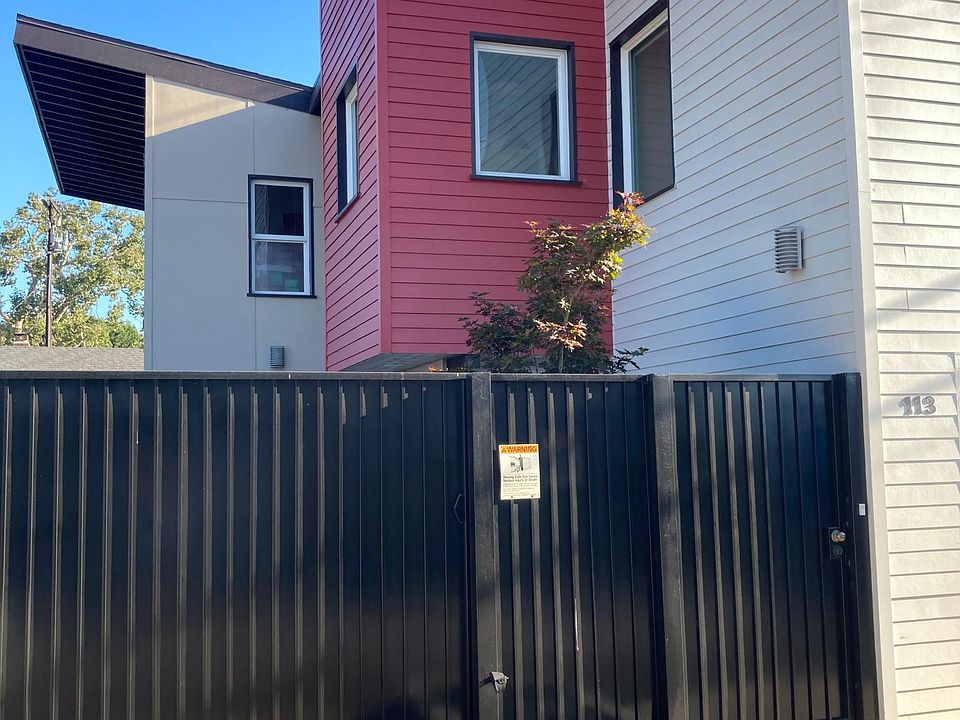 View of entry gate and electric rolling drive-through gate.