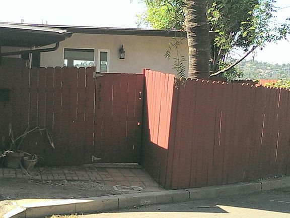 Front of House with redwood fencing!