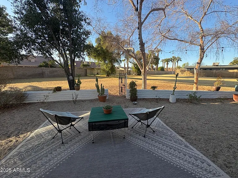 Backyard looking out to the green space (Green space doubles as a large, extended backyard. Maintained by the HOA)