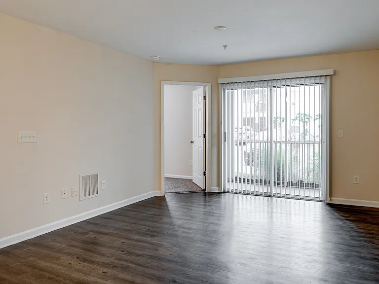 Spacious living room with private patio access.