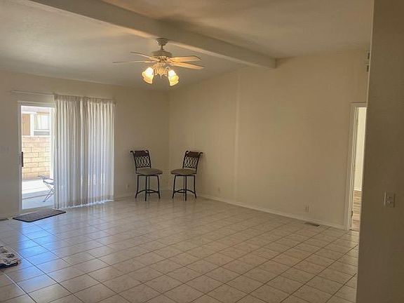 Family area off kitchen - tile floors walk out to patio. Spacious living area.