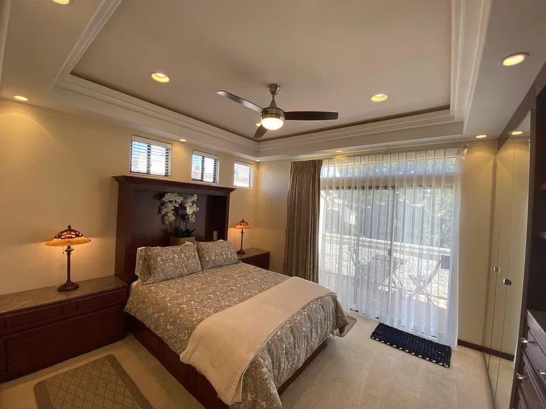 Master bedroom with beautiful drapery