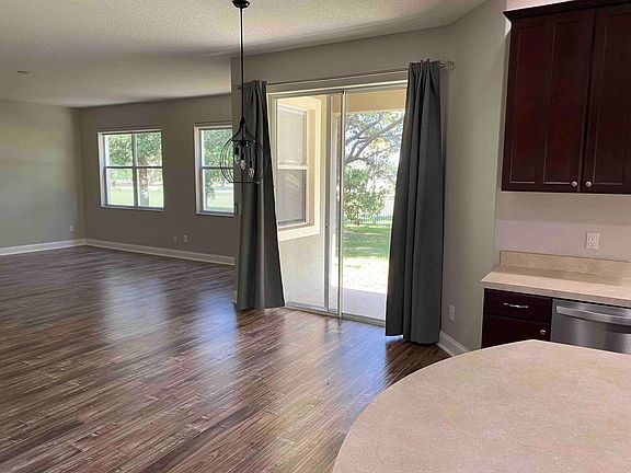 Dinette with large 20 x 20 living room with view of West Orange Country club