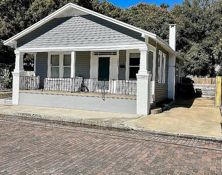 Relax on the front porch and enjoy the lively neighborhood.