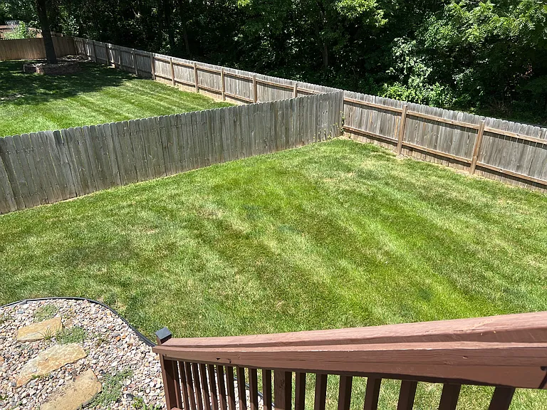 Spacious deck leading down to a large yard - new fence and backs to a walking path