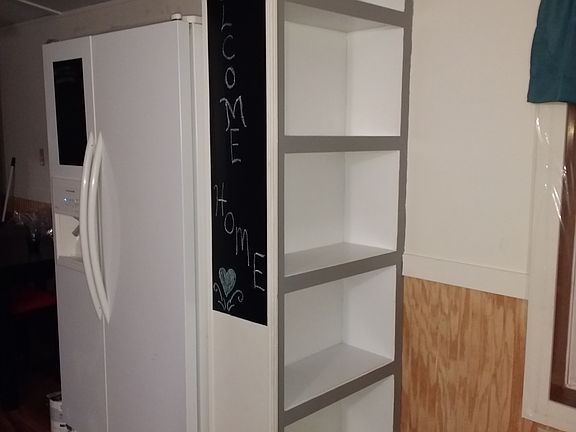 Bookshelf with chalkboard wall