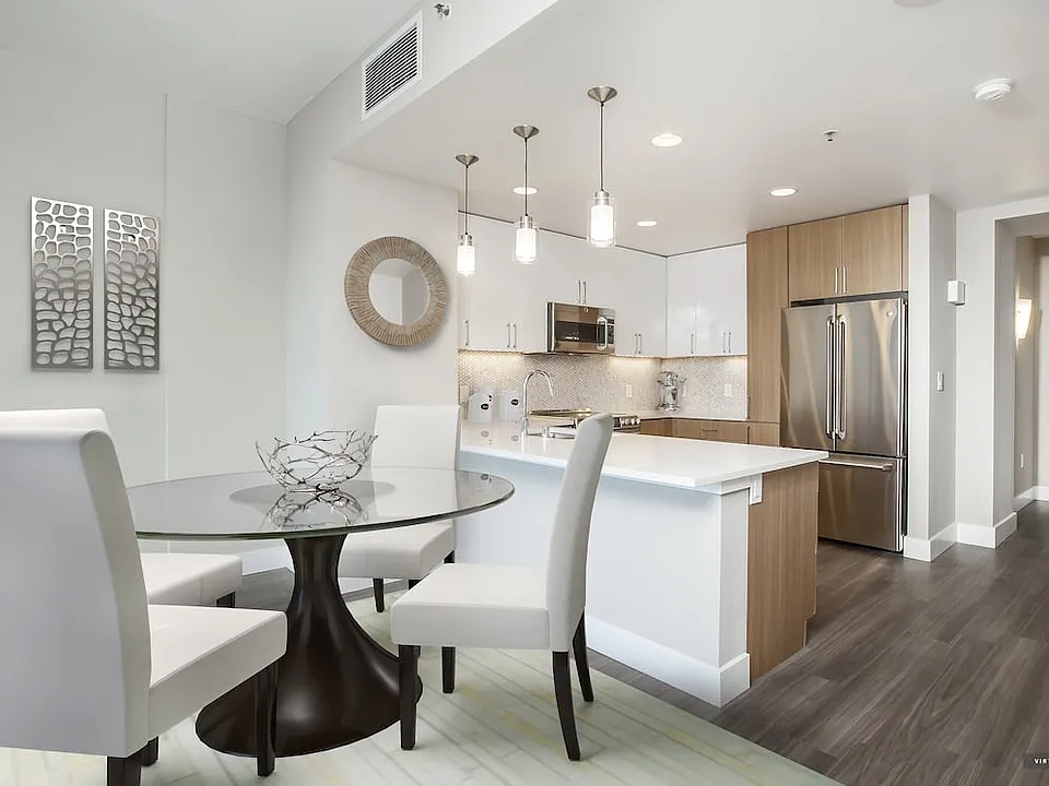 Signature Collection Dining and Kitchen Area with Hard Surface Vinyl Plank Flooring