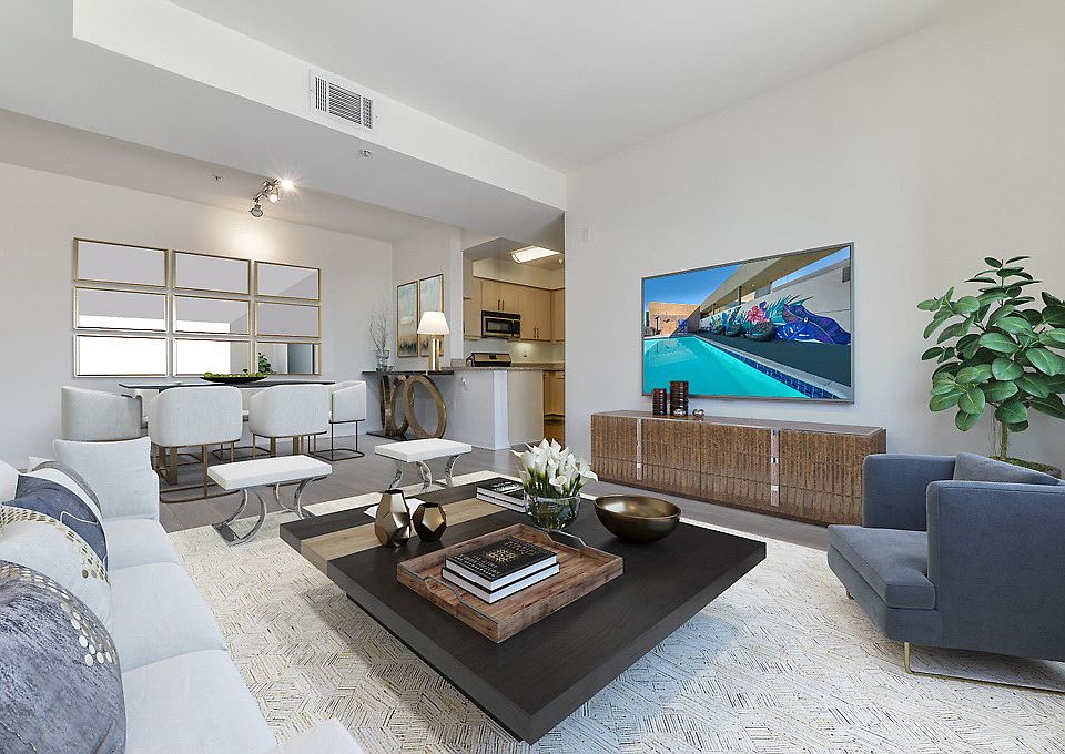 Staged living room with hardwood style flooring.