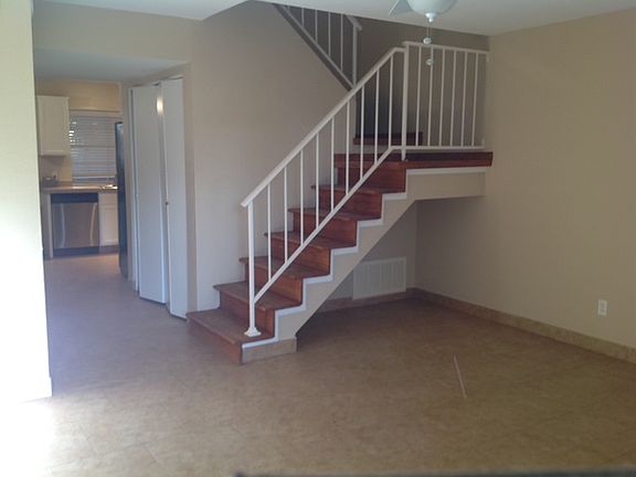 Kitchen in back. Laundry area in area just past stairway