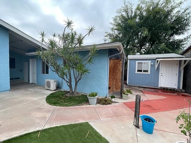 This is the front entrance to the left the detached artist loft/office is to the right