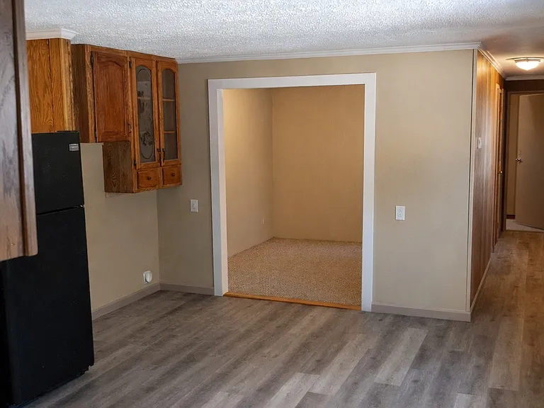 Kitchen looking into Living Room entry