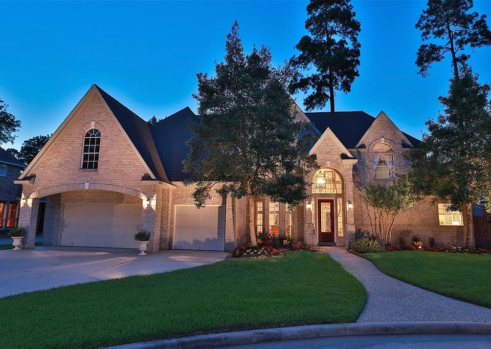 MAINTAINED WITH THE UTMOST CARE IN CHAMPIONS PARK NORTH - Built by Country Village Homes, this home is impressive. Loaded with style and modernized with wood tile flooring, marble entrance, new carpet and leather granite counter tops. The home featur