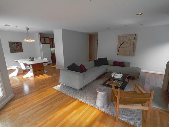 Open floorplan connects dining area and living room.