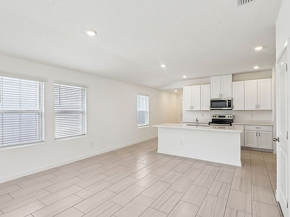 Dining Room and Kitchen at 7468 Queensgate Circle.