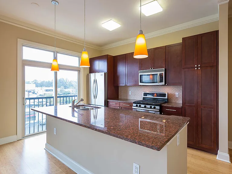 Stainless steel appliances and granites countertops in designer kitchen