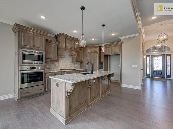 High ceilings with vaults in main entry and custom crafted decorative trim detail. Rocker light switches and lever door handles are all standard.