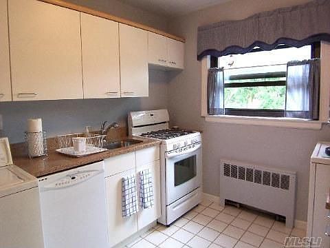 Large kitchen with many cabinets
