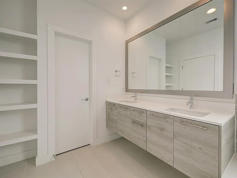 View of "Her" vanity in master bathroom.