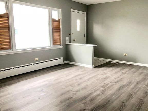 Sun-filled living room with all new floors