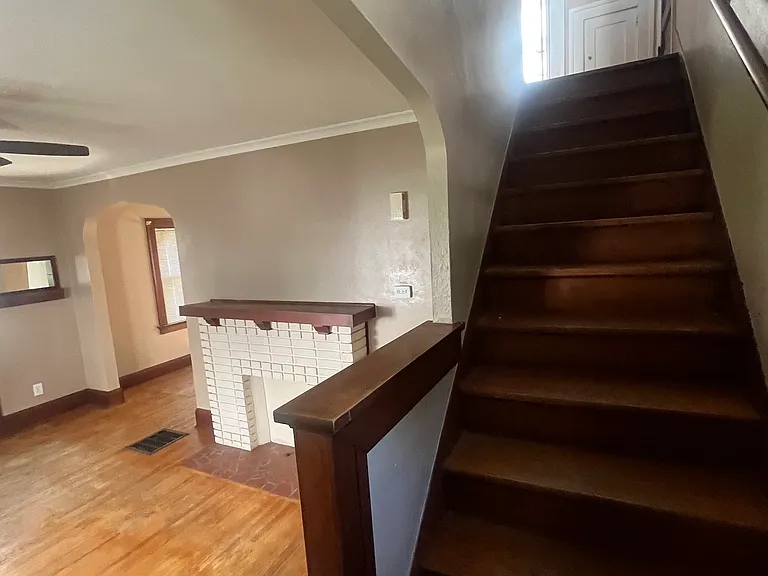 living room with decorative fireplace leading into dining room