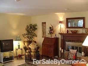 Family Room w/ Fireplace
						:
						Easy, comfortable, french doors onto the deck with great views of the outdoors.
