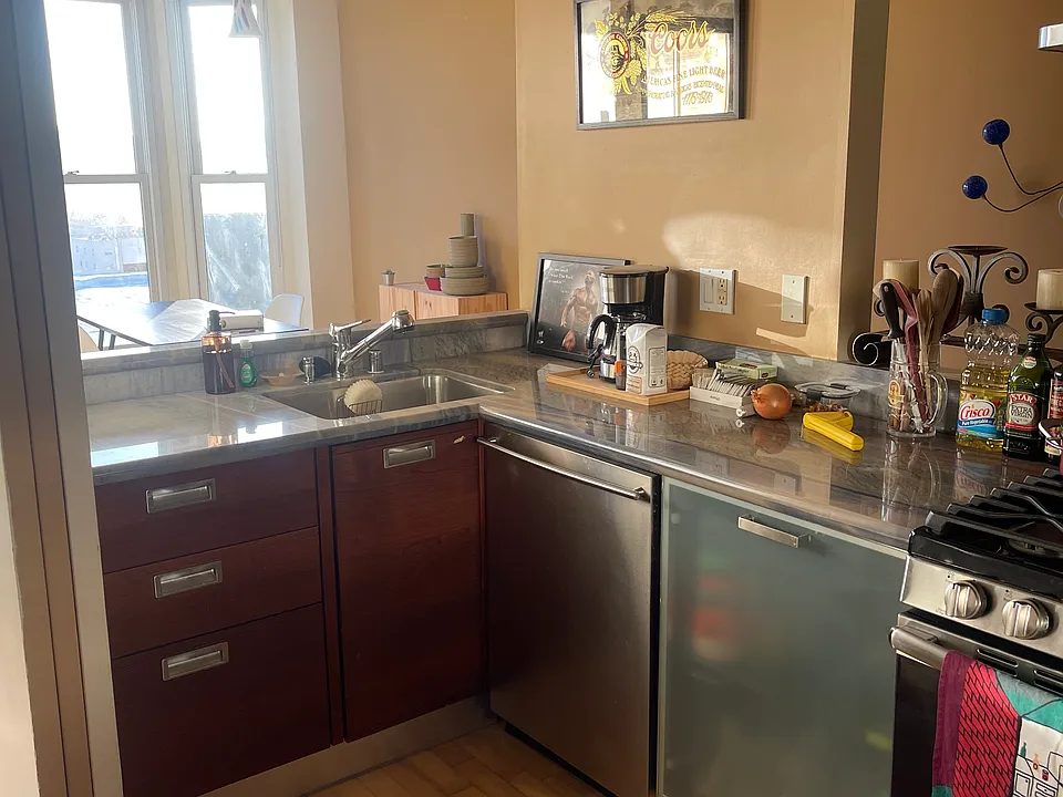View of kichen which has modern stainless appliances