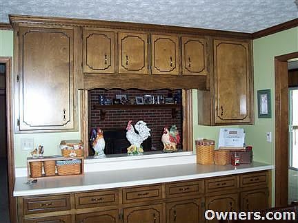 pass-thru from kitchen to living room, all custom cabinets