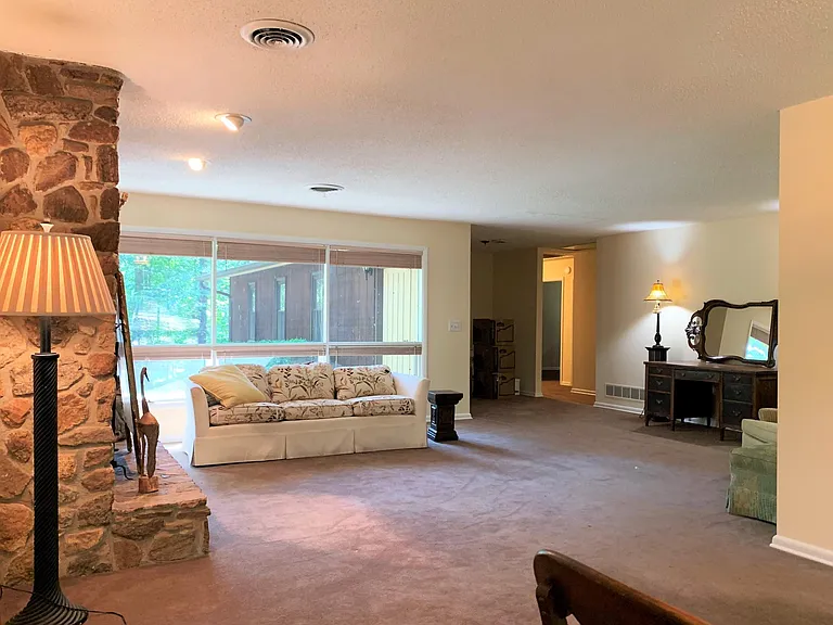 Spacious living room. Note: carpeting was recently replaced with waterproof laminate flooring. Updated photos to follow.