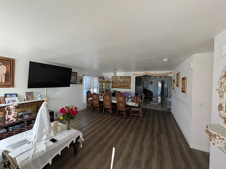 Shot of the Living/ dining space from the main entrance of the home.
