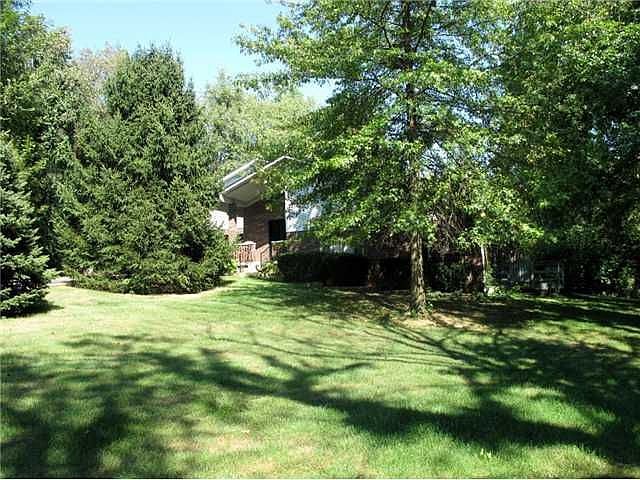 Cumberland Rd. on 1.57 wooded acre lot in the heart of Fishers.