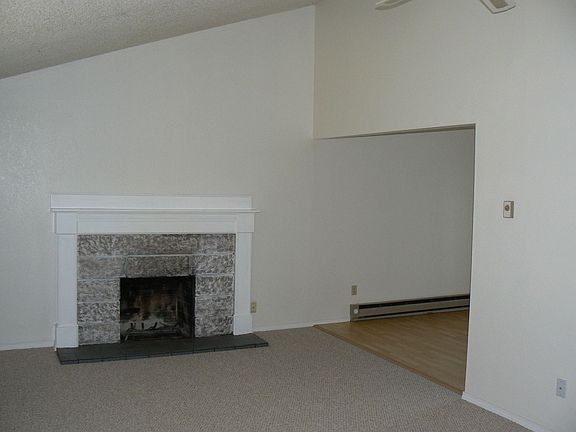 Inside, grand living w/vaulted ceilings!