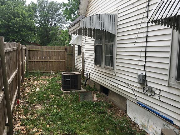 east view of house and privacy fence