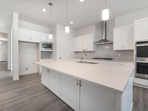 Spacious gourmet kitchen with large center island