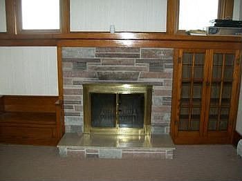 Nice fireplace with built in bench and book cases! Makes for a very cozy room - this is in a large l