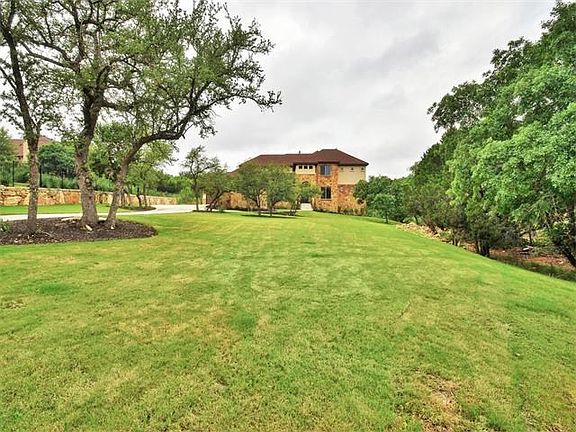 This MEGA-SIZED front yard provides tons of privacy and plenty of room for epic family soccer or football games!