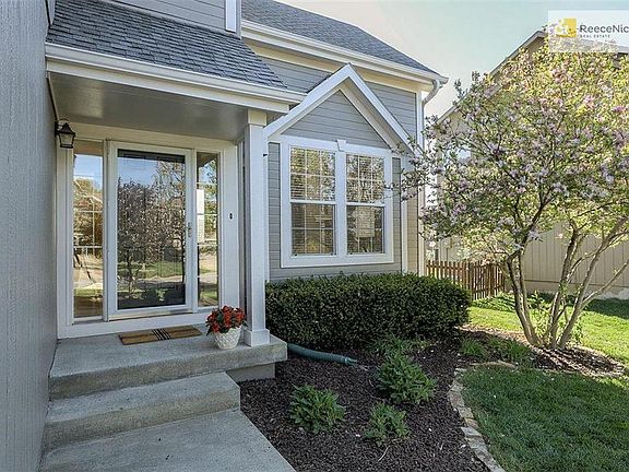 Pretty landscaping and fresh exterior paint (just painted at the end of April) enhance the curb appeal of this darling home.