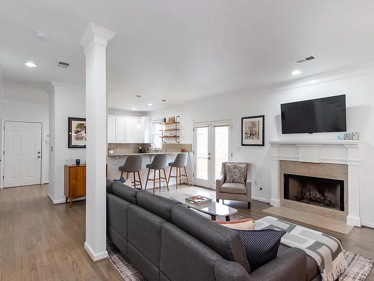 Open living area with gas starter fireplace