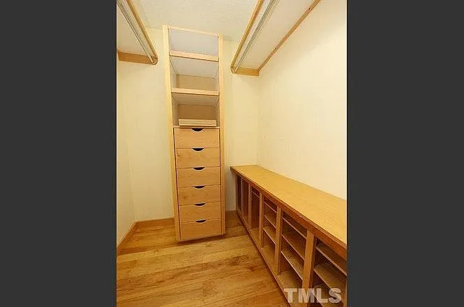 The master bedroom closet has custom built-ins