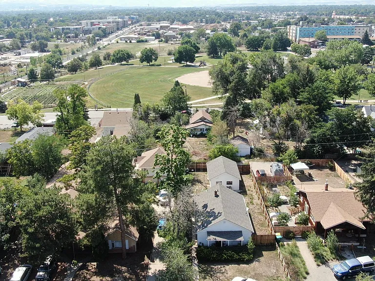 Aerial of house with Montair Park in background and Light rail line on the left side