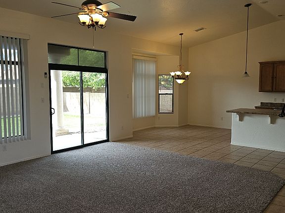 Living room to dining and kitchen, new carpet, new paint.
