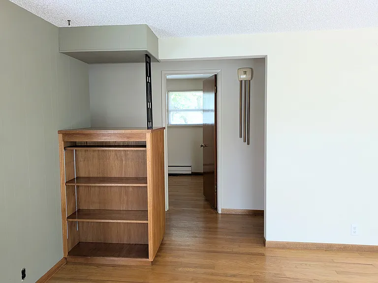From the living room, looking into the middle bedroom