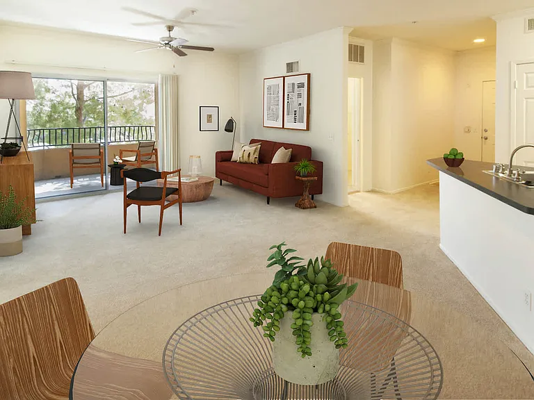 Open Concept Living Area with Sliding Glass Doors to Private Balcony