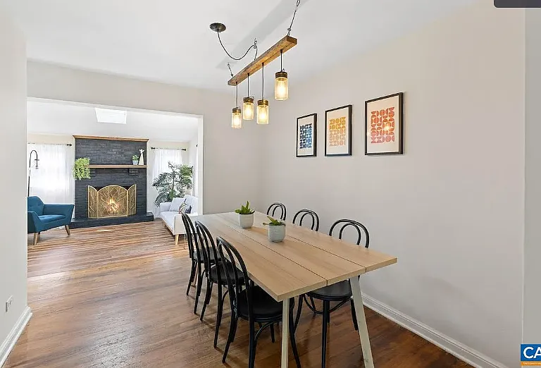 dining room with view to sitting room with fireplace