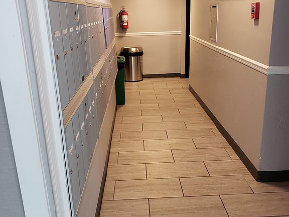 Elevator on left mailbox and hall to laundry room