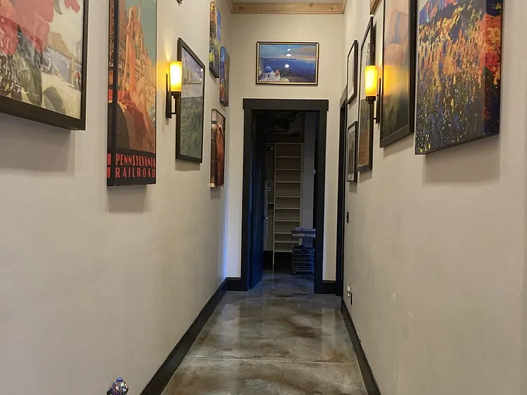 Enjoy the Art gallery as you venture to your bedroom and bath accommodations