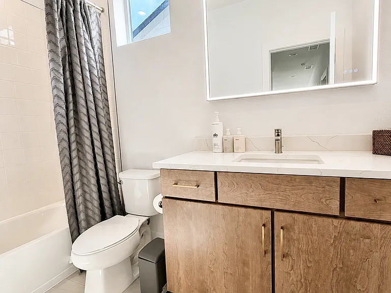 Full Second Bath with Custom LED-Lit Framed Vanity Mirror