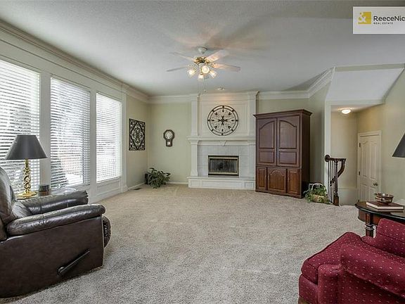 Kitchen is open to this lovely living room.